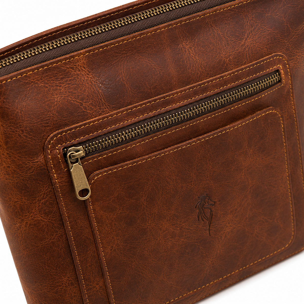 Close-up of Velora Arden showing the top zipper, front pocket zipper, metal hardware, stitching, and embossed logo.