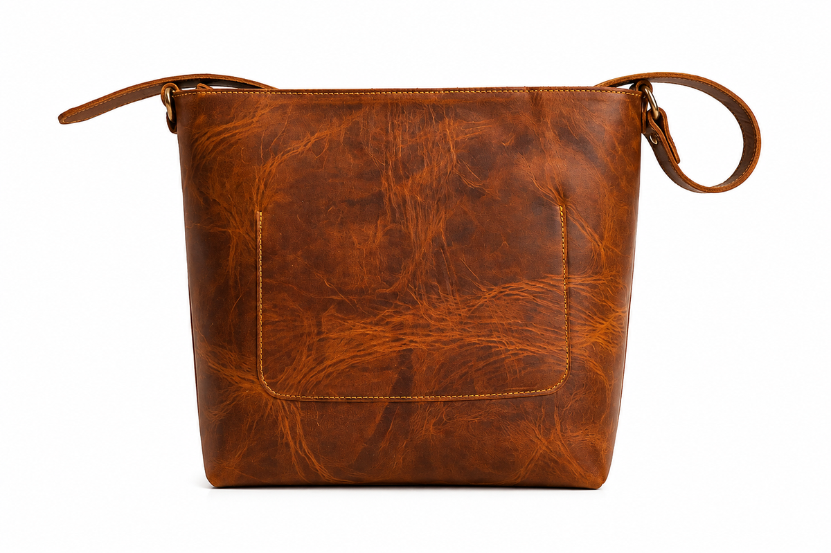 Rear view of Velora Arden showing the back slip pocket, stitching, and the strap attachment hardware, including an adjustable buckle.